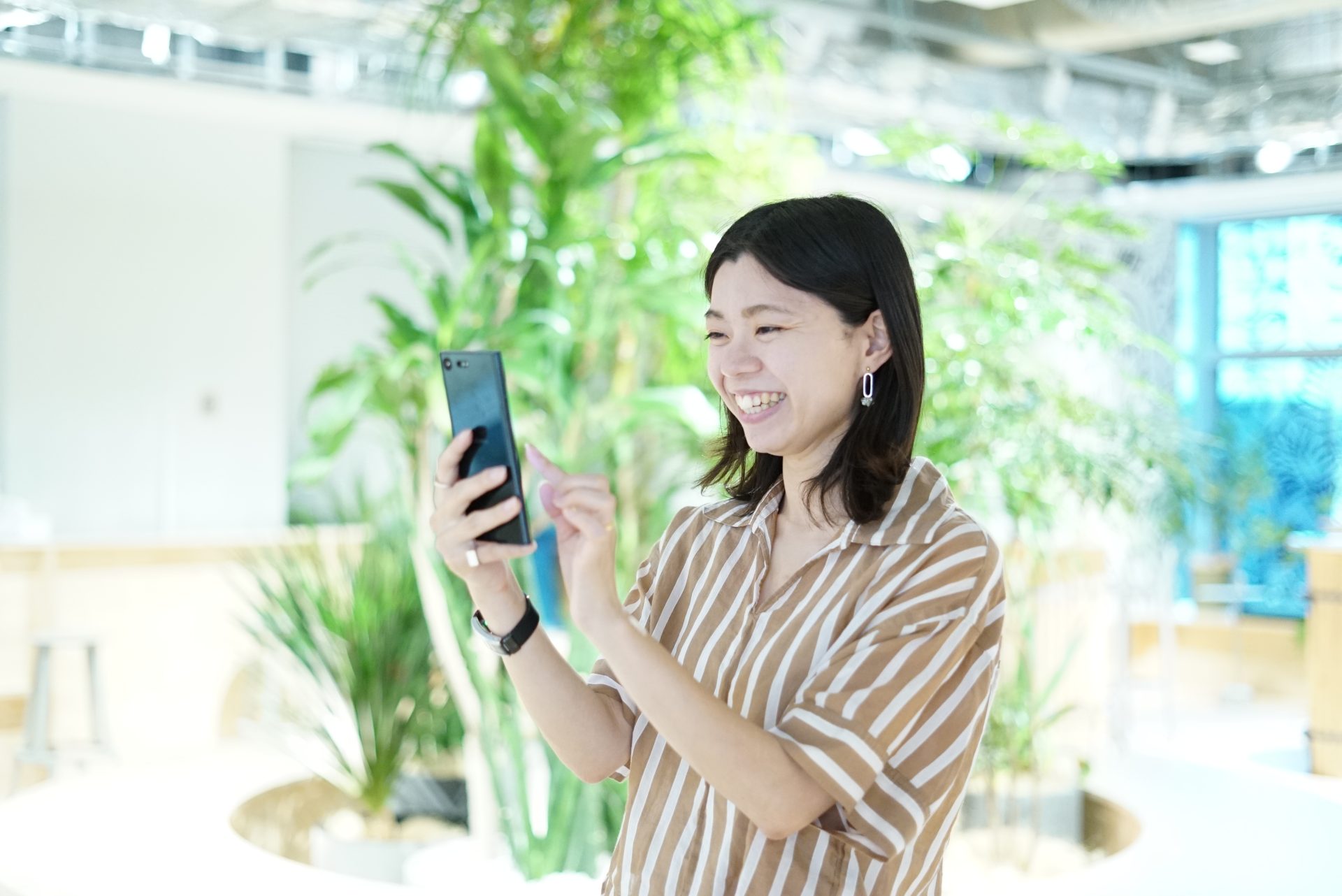 A woman operating a smartphone