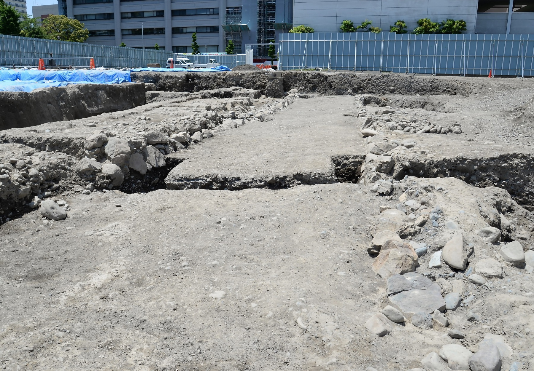 The state of the road and stone wall remains when they were discovered